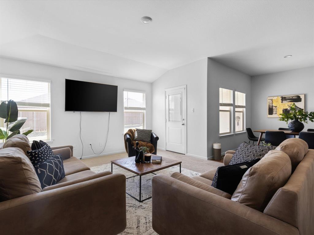 401 Attalla Street Azle, TX 76020 - Photo 5 of 24 a living room with furniture and a flat screen tv