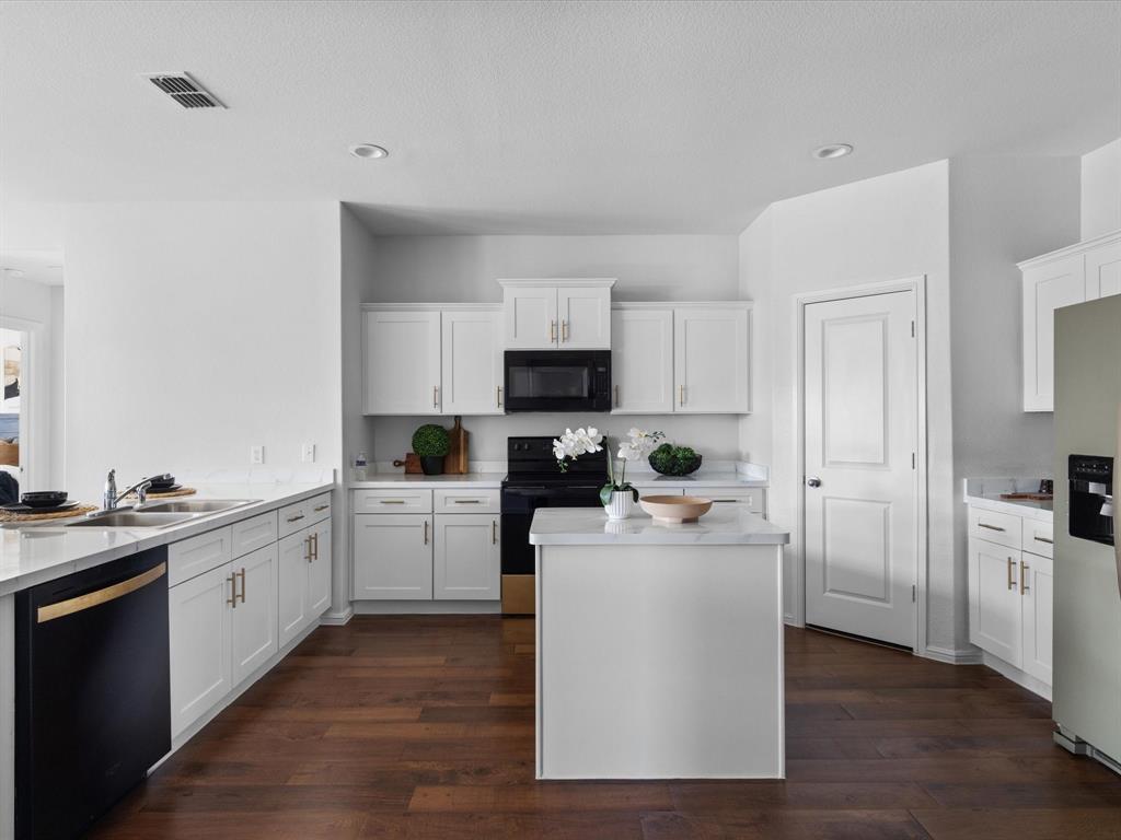 401 Attalla Street Azle, TX 76020 - Photo 6 of 24 a kitchen with a sink stove and cabinets