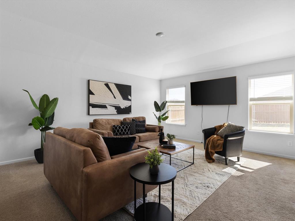 401 Attalla Street Azle, TX 76020 - Photo 8 of 24 a living room with furniture and a flat screen tv