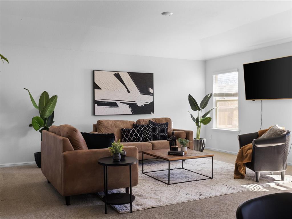 401 Attalla Street Azle, TX 76020 - Photo 9 of 24 a living room with furniture and a flat screen tv