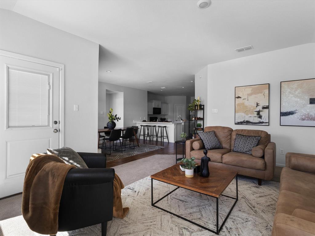 401 Attalla Street Azle, TX 76020 - Photo 10 of 24 a living room with furniture and a wooden floor
