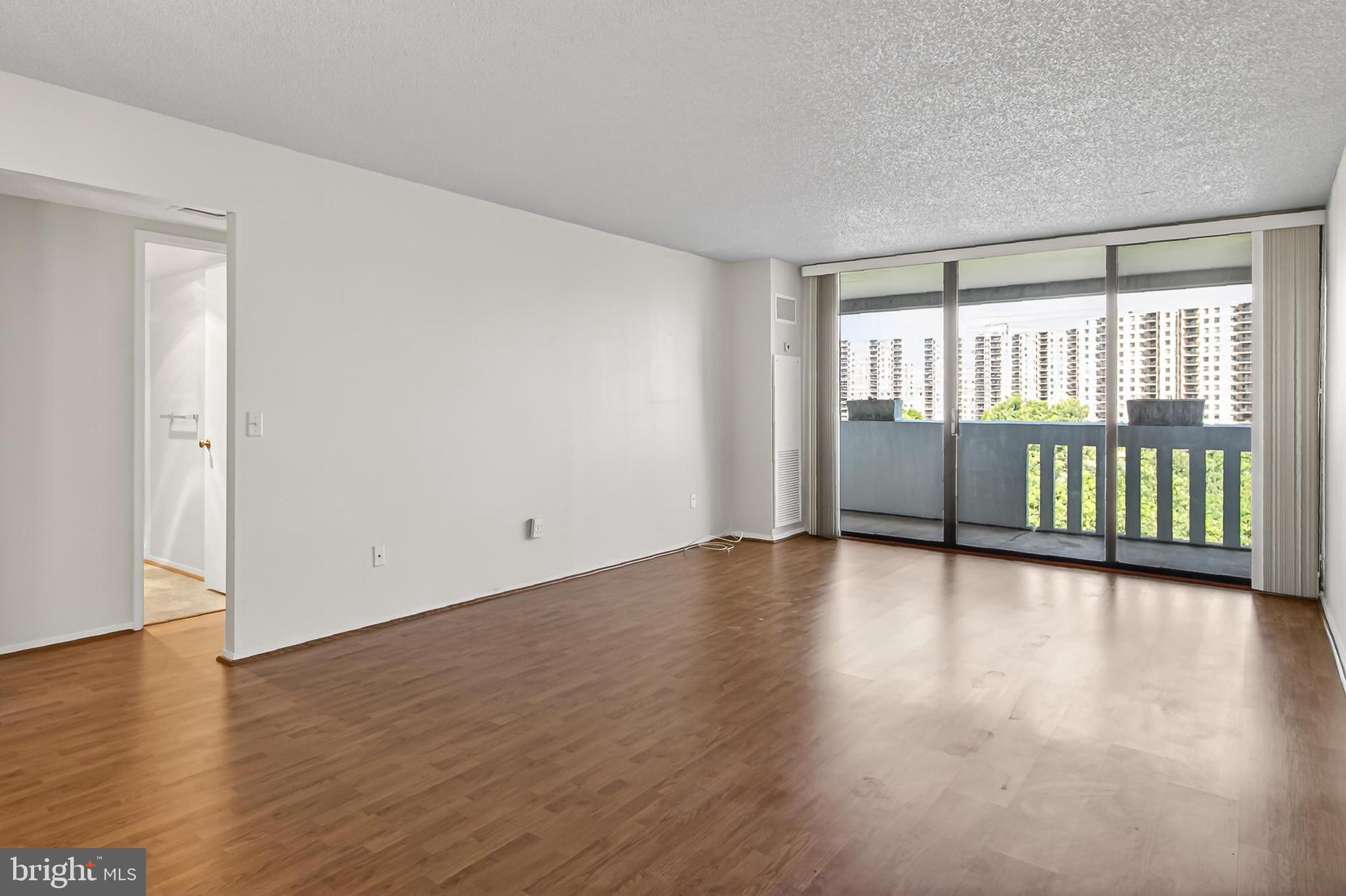 6101 Edsall Road, Unit 1206 Alexandria, VA 22304 - Photo 11 of 52 wooden floor in an empty room with a window