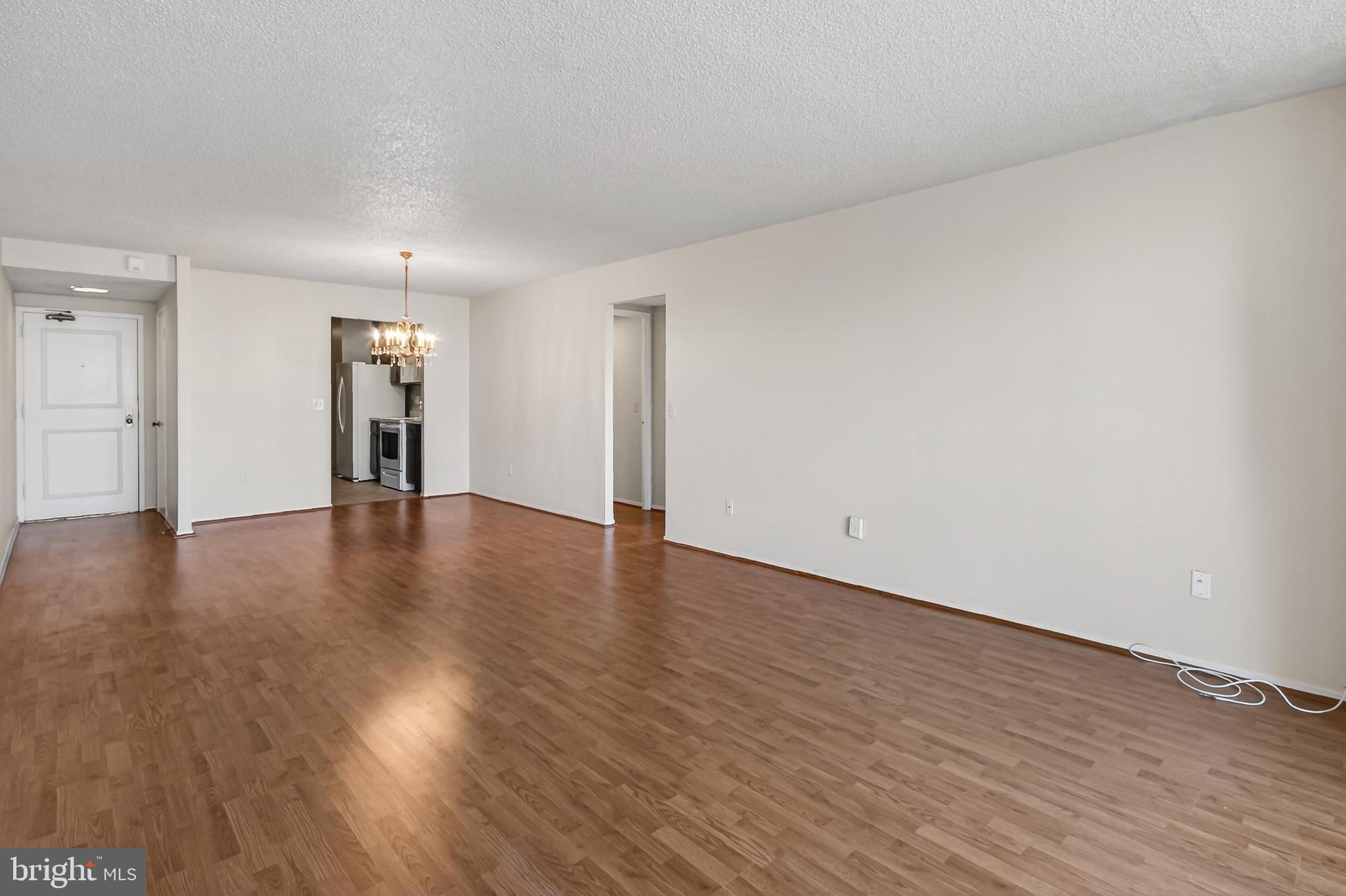 6101 Edsall Road, Unit 1206 Alexandria, VA 22304 - Photo 12 of 52 a view of an empty room with wooden floor