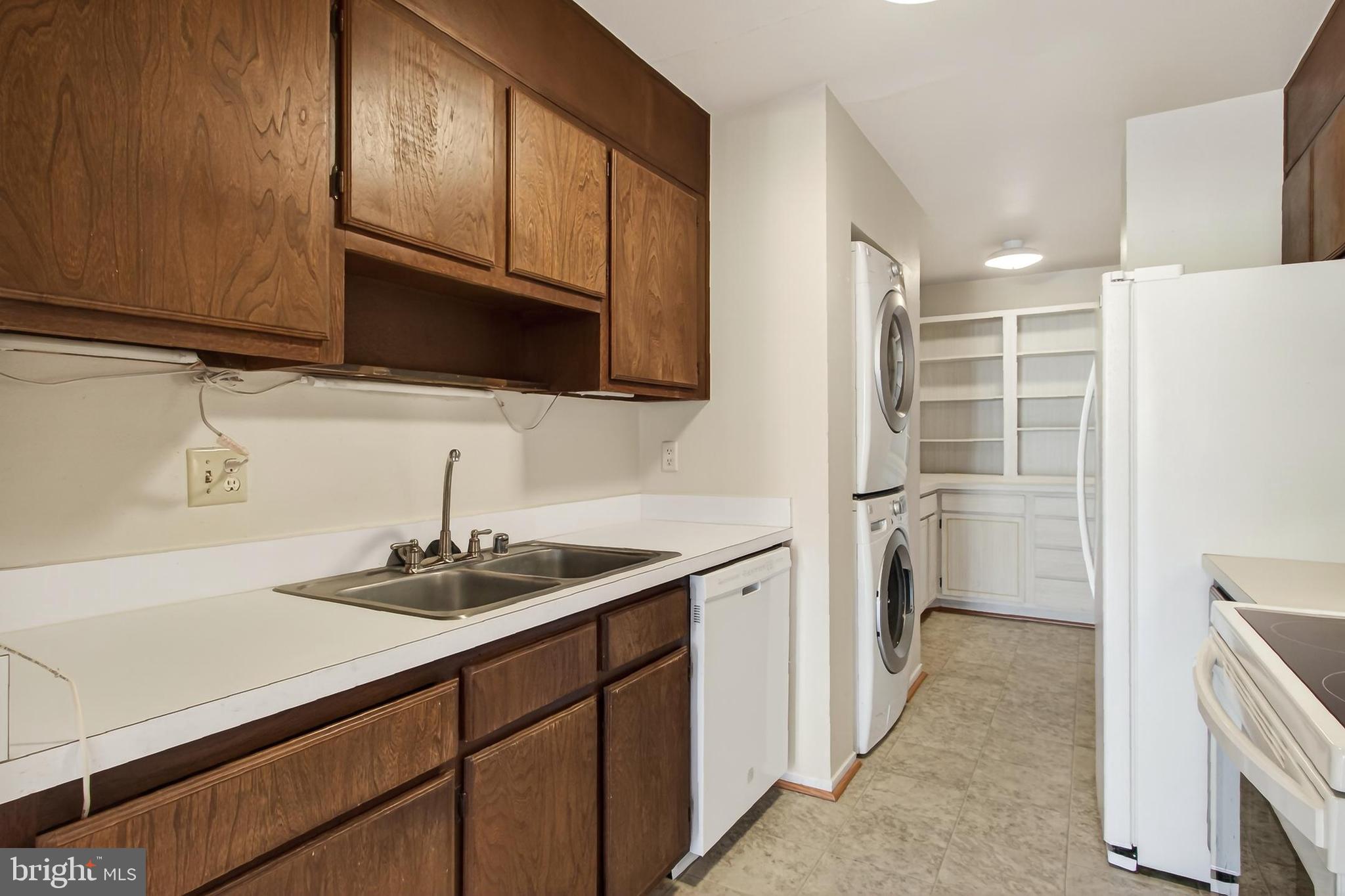 6101 Edsall Road, Unit 1206 Alexandria, VA 22304 - Photo 18 of 52 a kitchen with a sink and cabinets