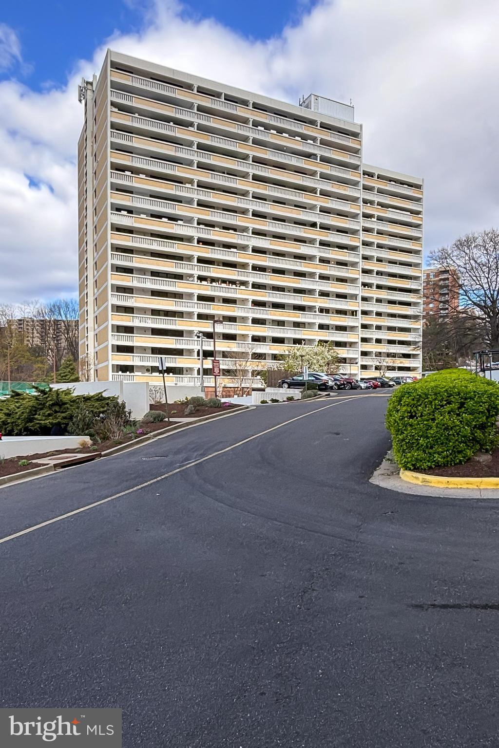 6101 Edsall Road, Unit 1206 Alexandria, VA 22304 - Photo 2 of 52 a front view of a building with a road