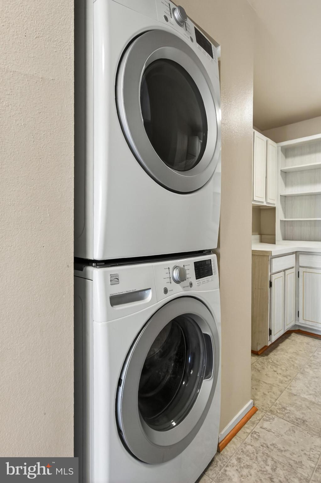 6101 Edsall Road, Unit 1206 Alexandria, VA 22304 - Photo 22 of 52 a view of a hallway with washer and dryer