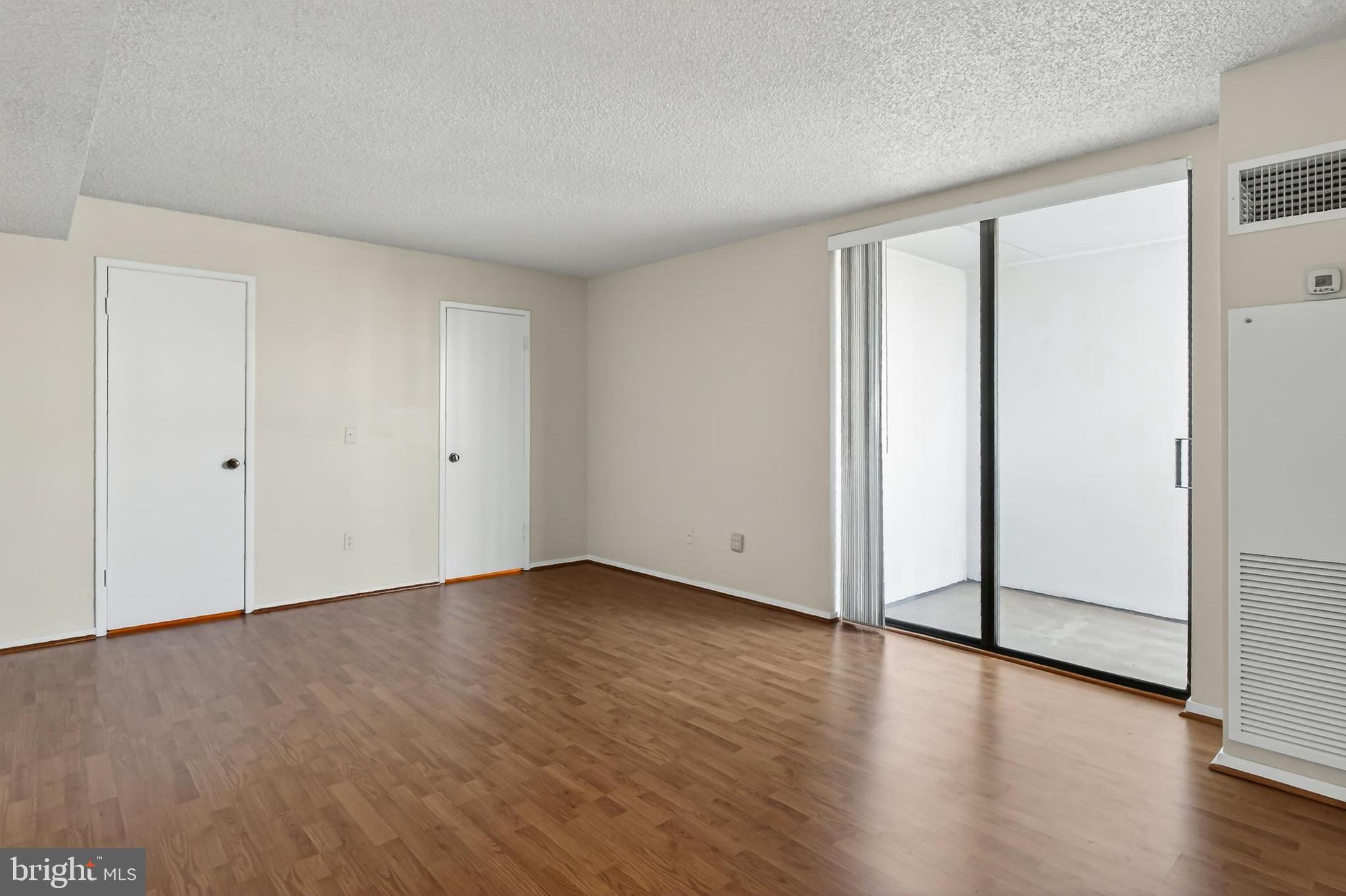 6101 Edsall Road, Unit 1206 Alexandria, VA 22304 - Photo 23 of 52 a view of an empty room with wooden floor