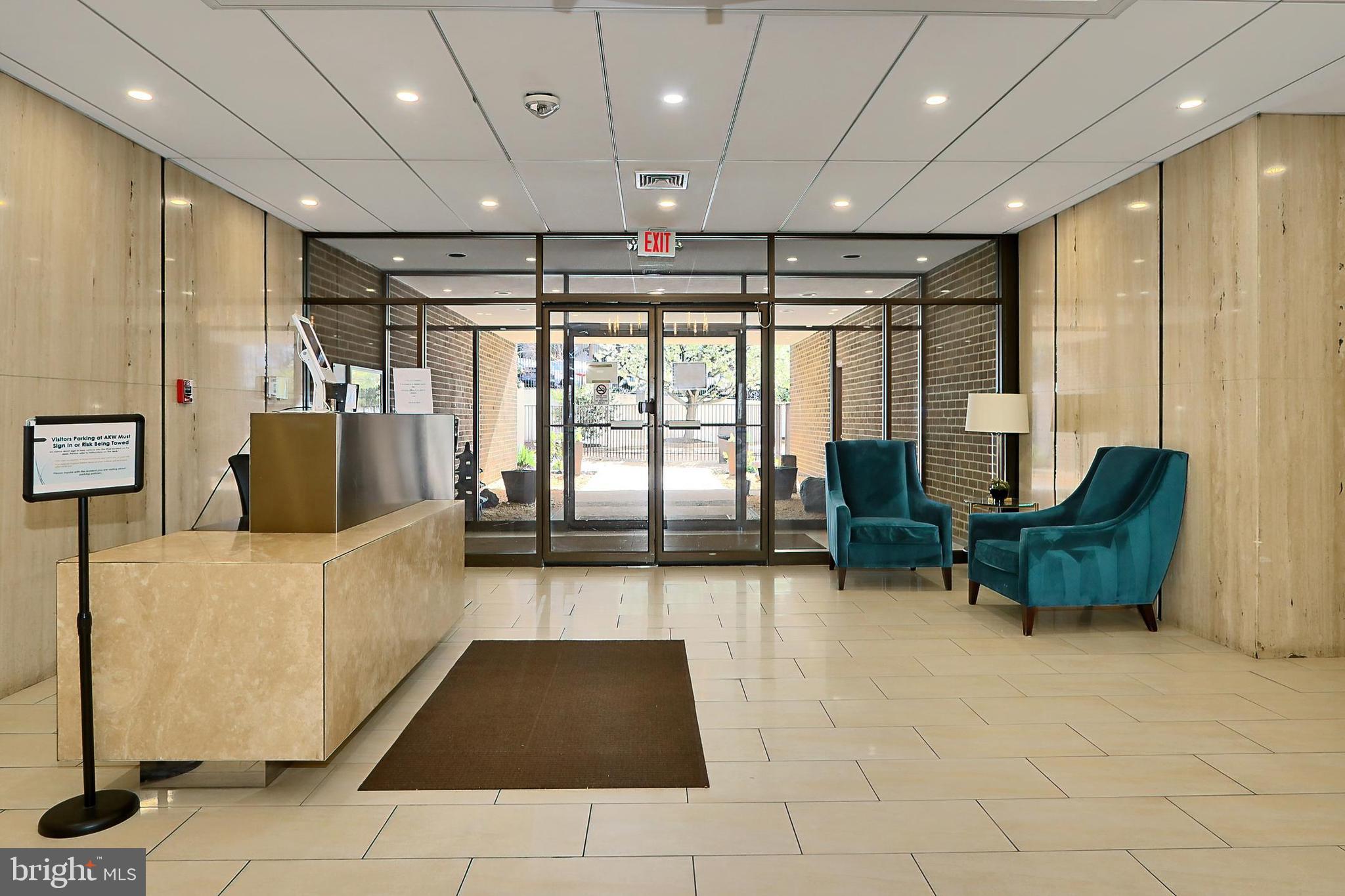 6101 Edsall Road, Unit 1206 Alexandria, VA 22304 - Photo 8 of 52 a lobby with furniture and a rug