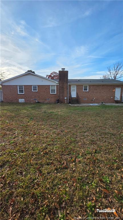 3023 Rouse Road Fayetteville, NC 28306 - Photo 2 of 12 a view of a house with a yard