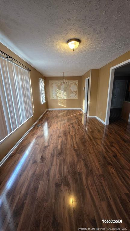 3023 Rouse Road Fayetteville, NC 28306 - Photo 3 of 12 a view of an empty room with wooden floor and a window