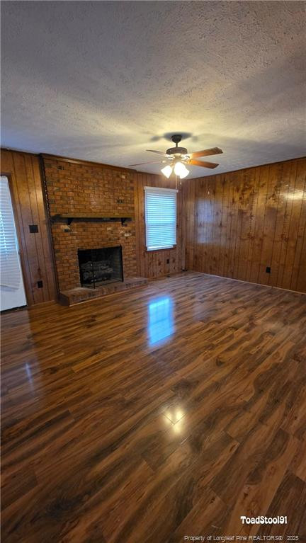 3023 Rouse Road Fayetteville, NC 28306 - Photo 4 of 12 an empty room with wooden floor fireplace and windows