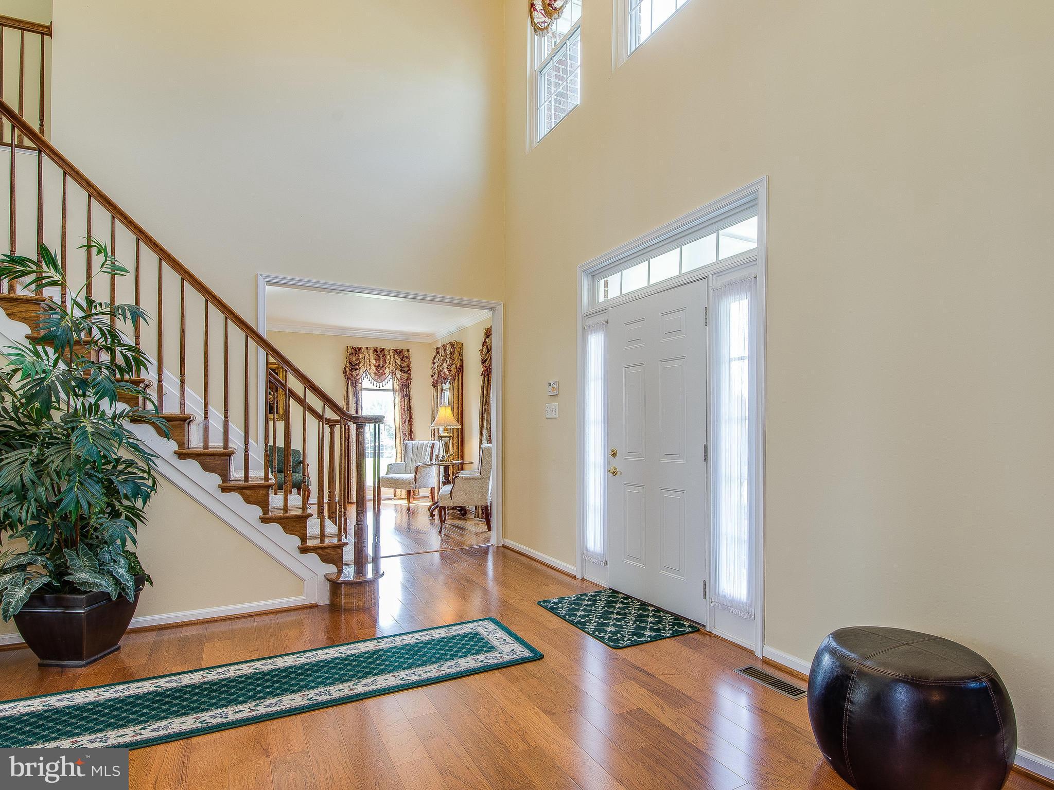 Grand 2-Story Foyer W/Hardwood Floors