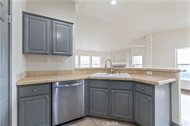 a kitchen with stainless steel appliances granite countertop a stove microwave and refrigerator