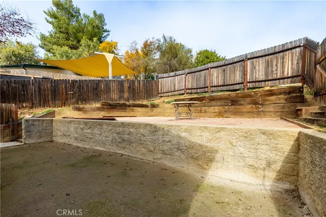a view of a swimming pool with a lounge chair
