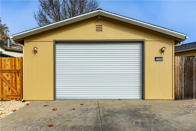 a view of a backyard with garage