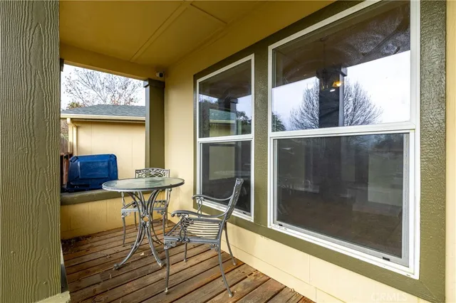 a view of a living room and dining room with wooden floor