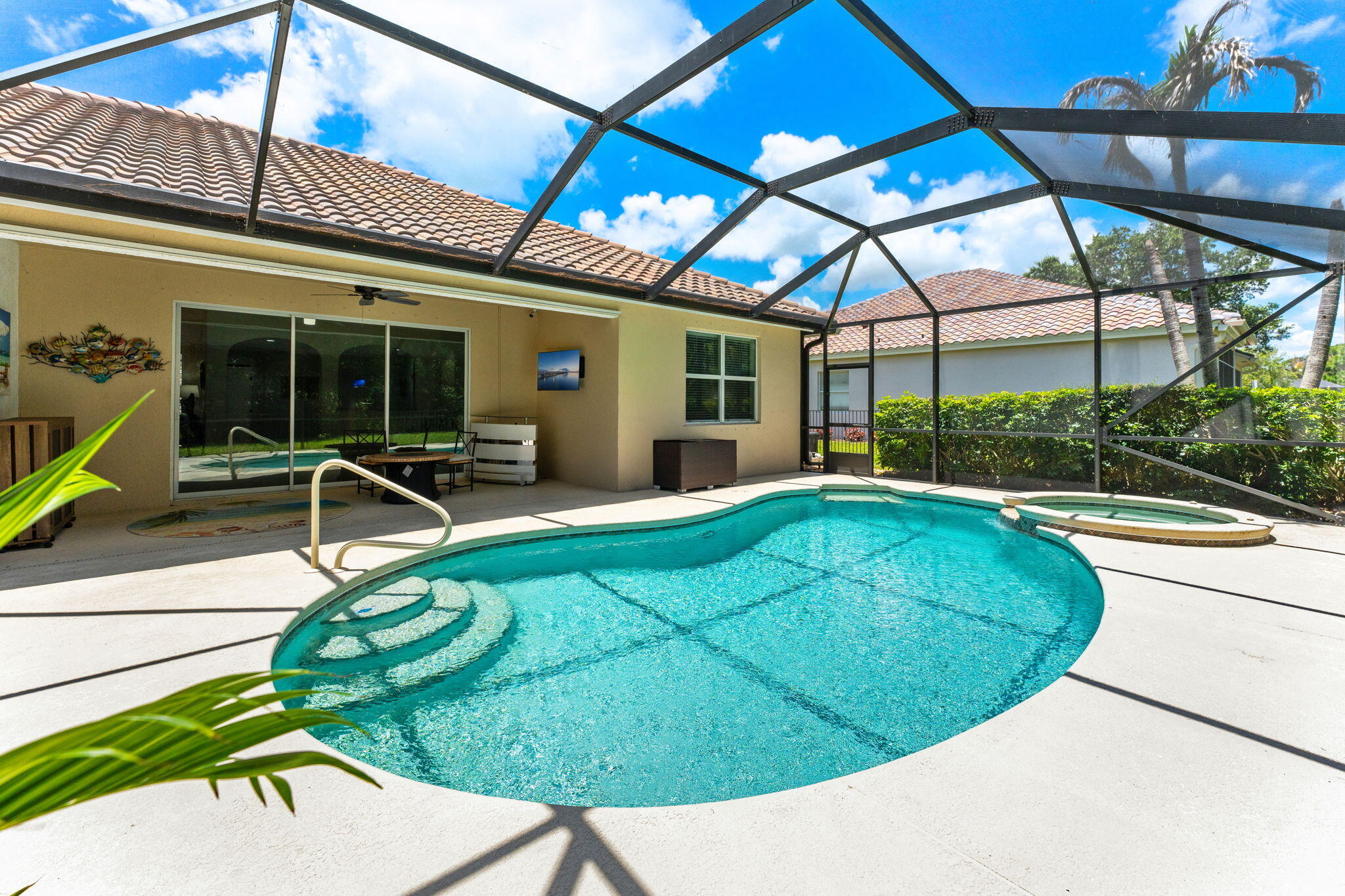 7657 Fieldstone Ranch Square Vero Beach, FL 32967 - Photo 38 of 52 a view of a swimming pool with a patio