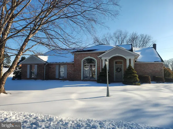a front view of a house with parking space