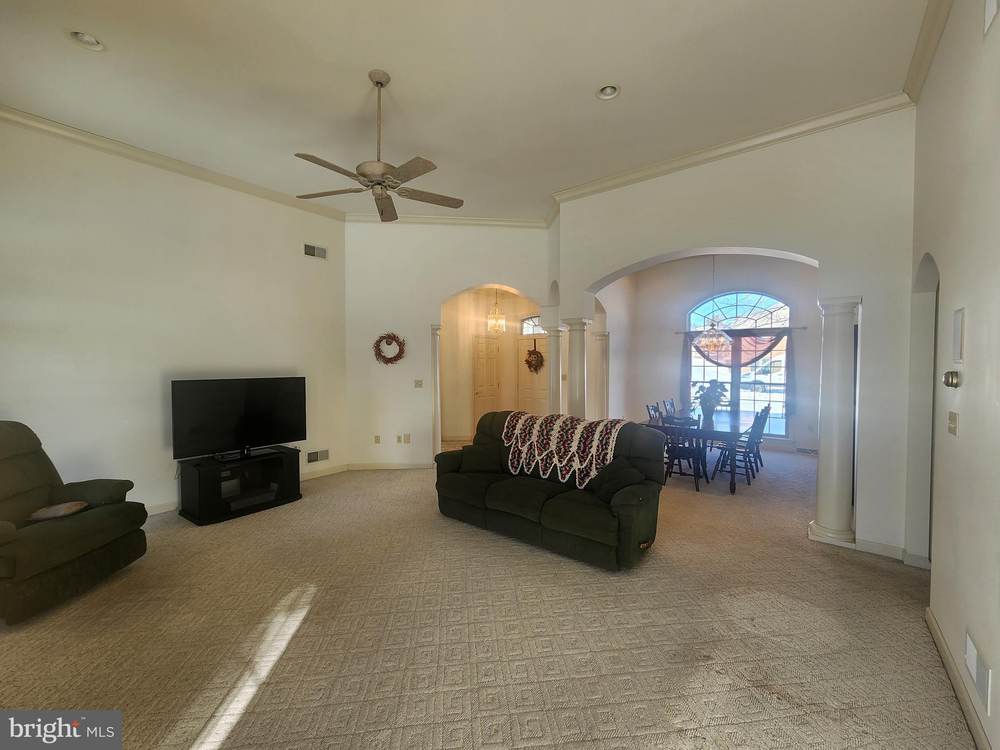 33 Tara Drive Lititz, PA 17543 - Photo 19 of 53 a living room with furniture a ceiling fan and a flat screen tv