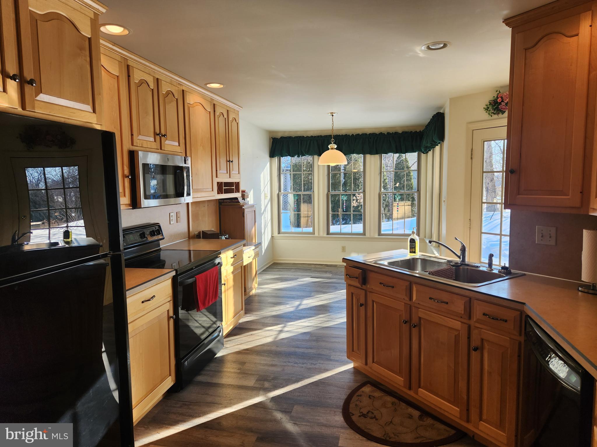 33 Tara Drive Lititz, PA 17543 - Photo 20 of 53 a kitchen with stainless steel appliances granite countertop a stove a sink and a refrigerator