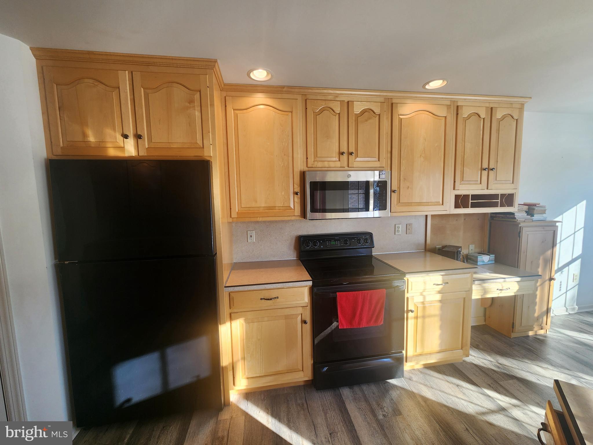 33 Tara Drive Lititz, PA 17543 - Photo 24 of 53 a kitchen with stainless steel appliances kitchen island granite countertop a stove a refrigerator and cabinets