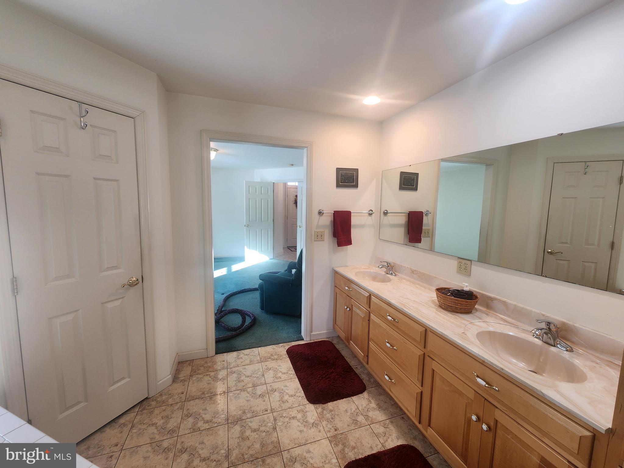 33 Tara Drive Lititz, PA 17543 - Photo 36 of 53 a spacious bathroom with a double vanity sink and mirror