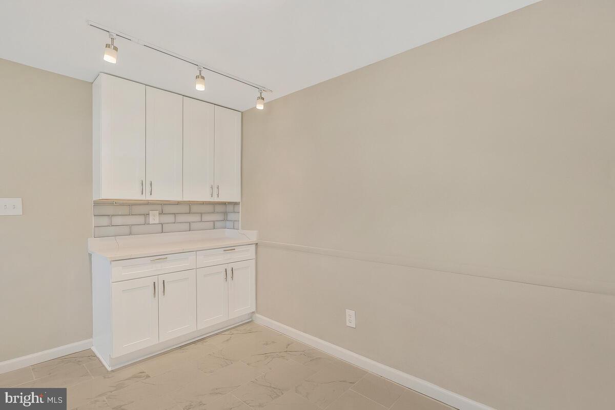6200 Auth Road Suitland, MD 20746 - Photo 12 of 30 a bathroom with a sink and cabinets