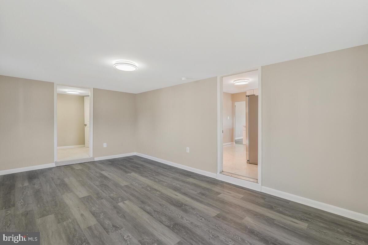 6200 Auth Road Suitland, MD 20746 - Photo 15 of 30 a view of an empty room with wooden floor
