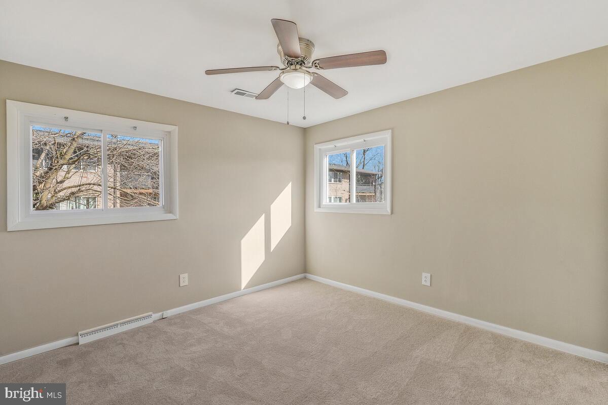 6200 Auth Road Suitland, MD 20746 - Photo 19 of 30 an empty room with a window and a ceiling fan