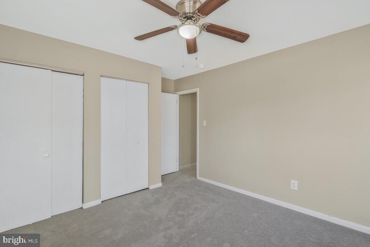 6200 Auth Road Suitland, MD 20746 - Photo 20 of 30 an empty room with a ceiling fan and a fan