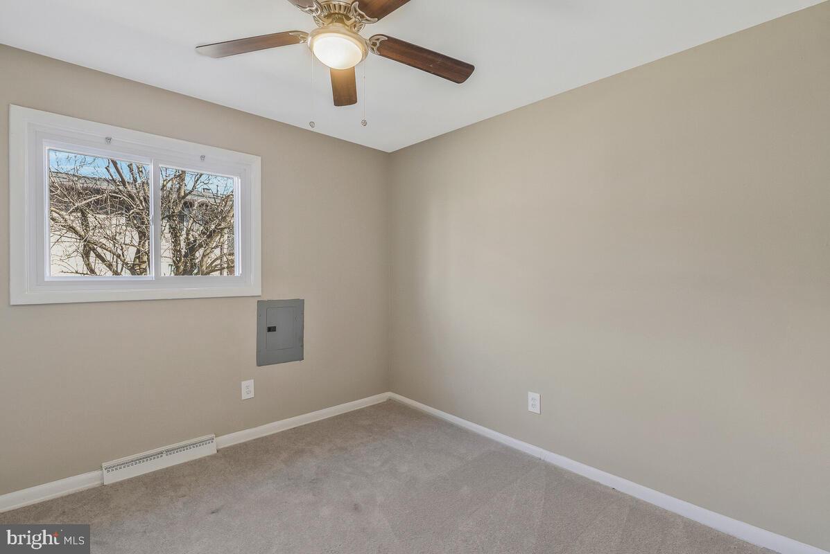 6200 Auth Road Suitland, MD 20746 - Photo 22 of 30 an empty room with a window and a fan