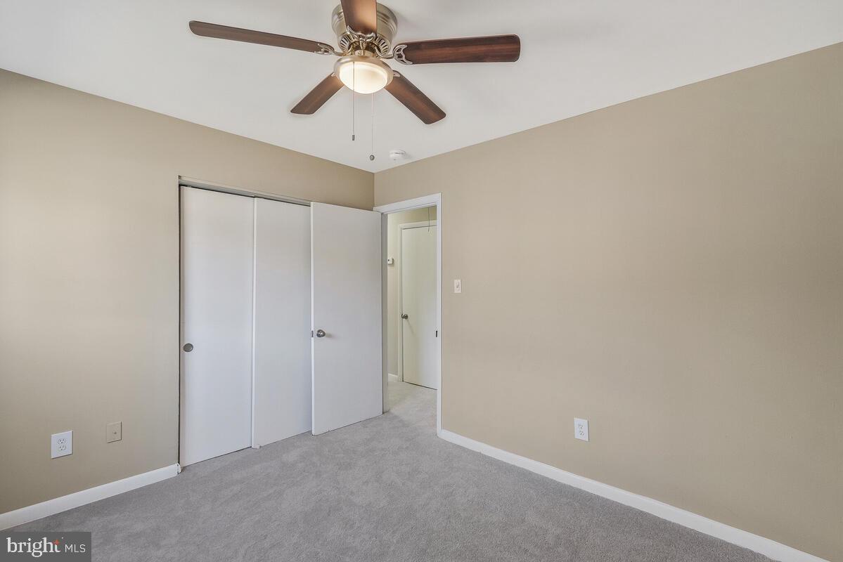 6200 Auth Road Suitland, MD 20746 - Photo 25 of 30 an empty room with chandelier fan