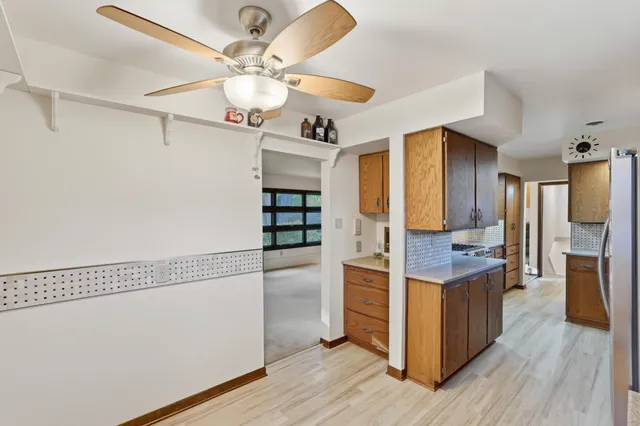 a kitchen that has a sink and a stove