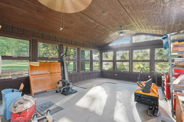 a view of outdoor space with deck and flat screen tv