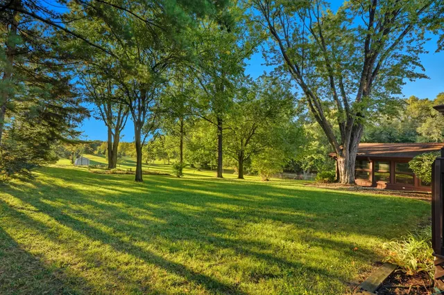 a view of a house with a big yard
