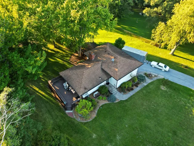 an aerial view of a house having yard