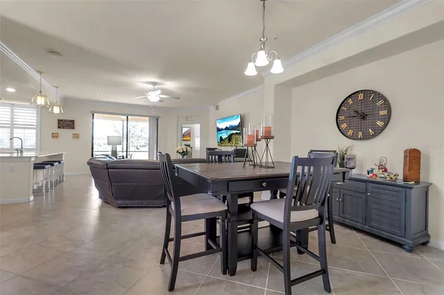 a kitchen with a sink a counter top space appliances and cabinets