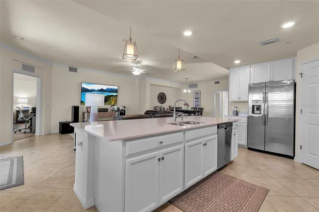 a kitchen with stainless steel appliances granite countertop a sink and stove