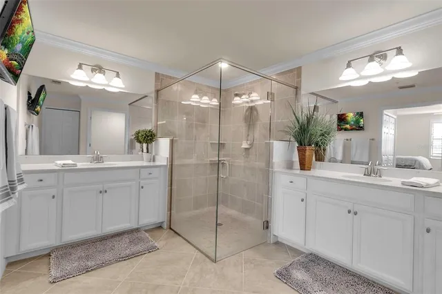 a bathroom with a granite countertop sink a toilet and shower