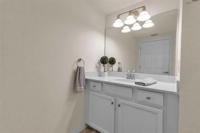 a bathroom with a bathtub sink and a mirror