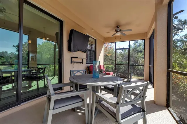 a living room with furniture fireplace and a window