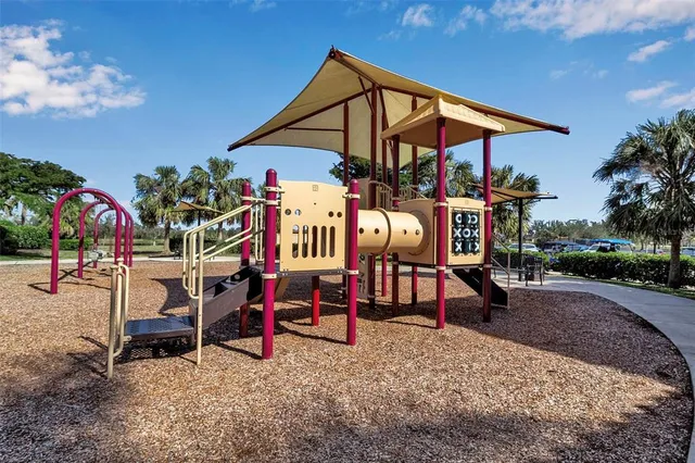 a lobby with furniture and floor to ceiling windows