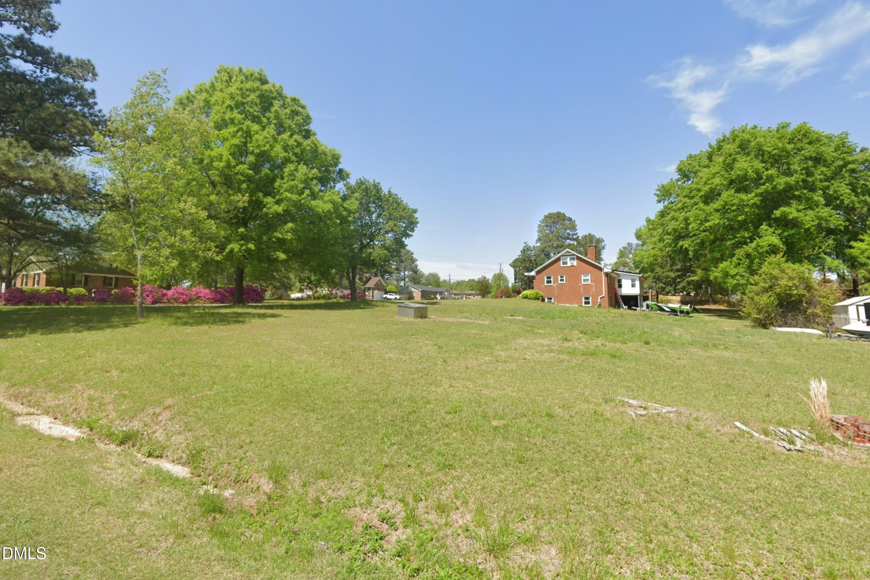 0 North Willow Street Angier, NC 27501 - Photo 15 of 16 a view of a field with grass and trees
