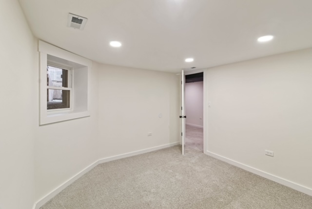 1018 North Harding Avenue Chicago, IL 60651 - Photo 20 of 38 an empty room with windows and closet