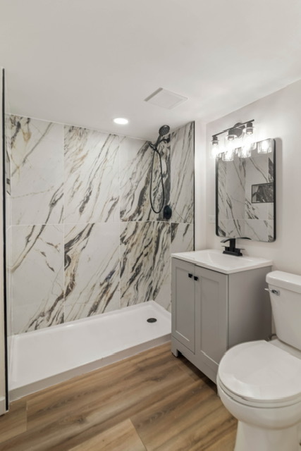 1018 North Harding Avenue Chicago, IL 60651 - Photo 21 of 38 a bathroom with a toilet sink and mirror