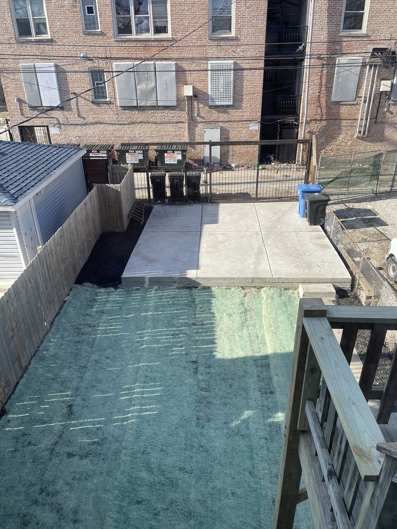 1018 North Harding Avenue Chicago, IL 60651 - Photo 34 of 38 a view of a patio with table and chairs