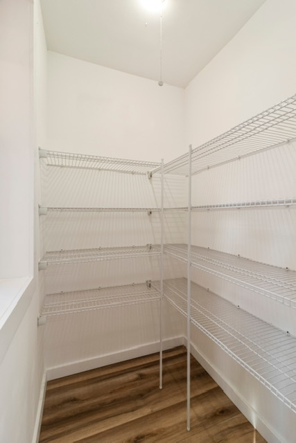 1018 North Harding Avenue Chicago, IL 60651 - Photo 10 of 38 a view of a room with racks on the wall