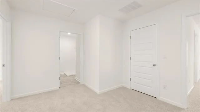 an empty room with closet area