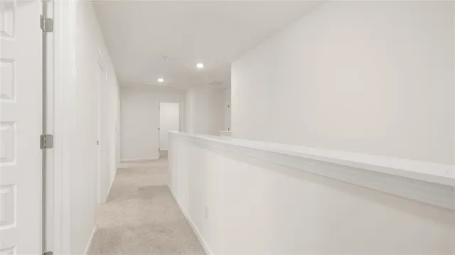 a view of hallway with bathtub