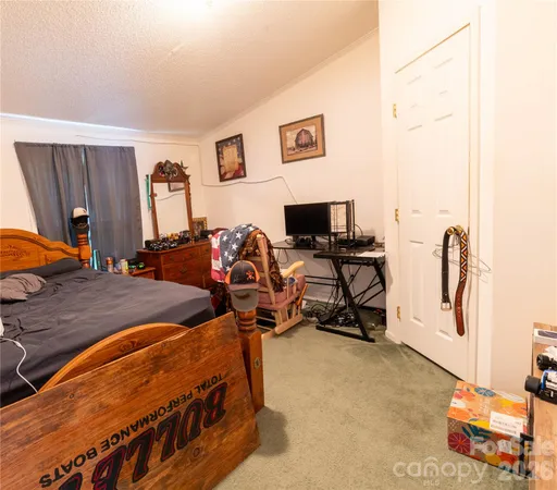 a bedroom with bed and a window